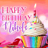 A vibrant birthday GIF featuring a rainbow-colored cupcake topped with white frosting, sprinkles, and a lit candle. The text reads 'Happy Birthday Nikole' in bold pink and violet letters with white outline.