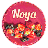 Beautifully decorated red velvet berry birthday cake with vibrant fruits and a glowing 'Noya' name, adding a touch of sweetness and sparkle.
