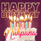 A colorful birthday cake topped with lit candles, with the words 'Happy Birthday Nukpana' in bold glowing letters on a burgundy background. Animated flames add a festive touch.