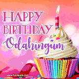A vibrant birthday GIF featuring a rainbow-colored cupcake topped with white frosting, sprinkles, and a lit candle. The text reads 'Happy Birthday Odahingum' in bold pink and violet letters with white outline.