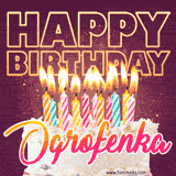 A colorful birthday cake topped with lit candles, with the words 'Happy Birthday Ogrofenka' in bold glowing letters on a burgundy background. Animated flames add a festive touch.