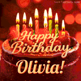 Beautifully decorated red velvet berry birthday cake with vibrant fruits and a glowing 'Olivia' name, adding a touch of sweetness and sparkle.