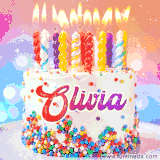 A cheerful white birthday cake with multicolor sprinkles, lit candles, and 'Olivia' written in vibrant letters, in an animated GIF.