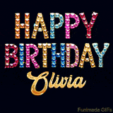 Vibrant luxury birthday greeting card for Olivia, showing glittering gemstone letters and golden calligraphy on a dark background with twinkling shine effects.