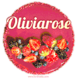 Beautifully decorated red velvet berry birthday cake with vibrant fruits and a glowing 'Oliviarose' name, adding a touch of sweetness and sparkle.