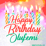 Bright birthday candles with rainbow flames on a cake, alongside the text 'Happy Birthday Olufemi' in vibrant script in this celebratory animated GIF.
