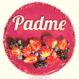 Beautifully decorated red velvet berry birthday cake with vibrant fruits and a glowing 'Padme' name, adding a touch of sweetness and sparkle.