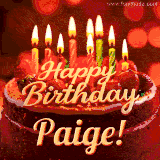 Beautifully decorated red velvet berry birthday cake with vibrant fruits and a glowing 'Paige' name, adding a touch of sweetness and sparkle.