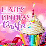 A vibrant birthday GIF featuring a rainbow-colored cupcake topped with white frosting, sprinkles, and a lit candle. The text reads 'Happy Birthday Paislee' in bold pink and violet letters with white outline.