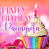 A vibrant birthday GIF featuring a rainbow-colored cupcake topped with white frosting, sprinkles, and a lit candle. The text reads 'Happy Birthday Panagiota' in bold pink and violet letters with white outline.