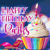 A festive animated GIF featuring a colorful cupcake with a single lit candle, sprinkles, and 'Happy Birthday Parks' text against a sparkling, celebratory background.