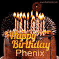 A rich chocolate cake topped with glowing birthday candles and surrounded by bright fireworks. The animated GIF displays the message 'Happy Birthday Phenix' in golden text.