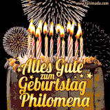 A chocolate birthday cake with glowing candles, the German text 'Alles Gute zum Geburtstag Philomena,' and vibrant fireworks lighting up the background in an animated GIF.