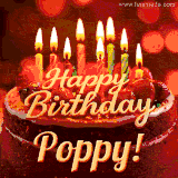Beautifully decorated red velvet berry birthday cake with vibrant fruits and a glowing 'Poppy' name, adding a touch of sweetness and sparkle.