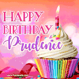 A vibrant birthday GIF featuring a rainbow-colored cupcake topped with white frosting, sprinkles, and a lit candle. The text reads 'Happy Birthday Prudence' in bold pink and violet letters with white outline.