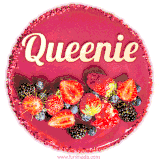 Beautifully decorated red velvet berry birthday cake with vibrant fruits and a glowing 'Queenie' name, adding a touch of sweetness and sparkle.
