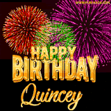 A golden 'Happy Birthday Quincey' message with vibrant fireworks in the background, creating a festive and celebratory vibe in this animated name GIF.