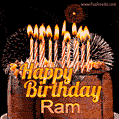 A rich chocolate cake topped with glowing birthday candles and surrounded by bright fireworks. The animated GIF displays the message 'Happy Birthday Ram' in golden text.