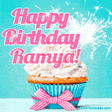 A festive cupcake with pink icing, a gingham bow, and a lit animated sparkler, paired with 'Happy Birthday Ramya!' in bright pink text.