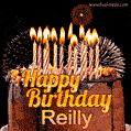 A rich chocolate cake topped with glowing birthday candles and surrounded by bright fireworks. The animated GIF displays the message 'Happy Birthday Reilly' in golden text.