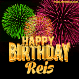A captivating GIF with bursts of green, pink, and orange fireworks lighting up the night sky, accompanied by 'Happy Birthday Reis' in glowing golden text.