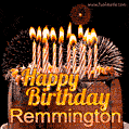 A rich chocolate cake topped with glowing birthday candles and surrounded by bright fireworks. The animated GIF displays the message 'Happy Birthday Remmington' in golden text.