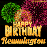 A captivating GIF with bursts of green, pink, and orange fireworks lighting up the night sky, accompanied by 'Happy Birthday Remmington' in glowing golden text.