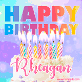 A vibrant animated name GIF with the words 'Happy Birthday Rheagan' with colorful candles on a creamy cake. The background sparkles with pastel shades, adding a festive touch.