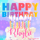 A vibrant animated name GIF with the words 'Happy Birthday Rhylie' with colorful candles on a creamy cake. The background sparkles with pastel shades, adding a festive touch.