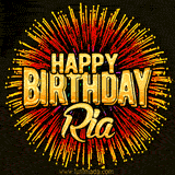Golden 'Happy Birthday Ria' text accompanied by animated rainbow fireworks for a festive animated greeting.