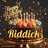 Chocolate cake with colorful icing swirls on top and the name Riddick written on the chocolate frosting under lit candles.