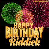 A captivating GIF with bursts of green, pink, and orange fireworks lighting up the night sky, accompanied by 'Happy Birthday Riddick' in glowing golden text.