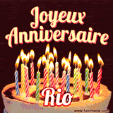 A Happy Birthday GIF in French featuring a festive birthday cake adorned with bright candles and the glowing text 'Joyeux Anniversaire Rio' in a cheerful style.