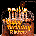 A rich chocolate cake topped with glowing birthday candles and surrounded by bright fireworks. The animated GIF displays the message 'Happy Birthday Rishav' in golden text.