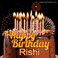 A rich chocolate cake topped with glowing birthday candles and surrounded by bright fireworks. The animated GIF displays the message 'Happy Birthday Rishi' in golden text.