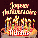 A Happy Birthday GIF in French featuring a festive birthday cake adorned with bright candles and the glowing text 'Joyeux Anniversaire Ritchie' in a cheerful style.