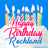 A cheerful animated GIF featuring colorful lit birthday candles on a white cake, with the text 'Happy Birthday Rockland' in bold red and blue script on a bright blue background.