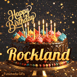 Custom birthday ecard for Rockland showing a gourmet chocolate cake on a dark background with golden star sparkles.