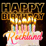 A vibrant animated GIF featuring a delicious birthday cake topped with glowing candles and the name 'Rockland' in elegant script, and the words 'Happy Birthday' on the black background.