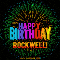 A colorful animated GIF featuring the text 'Happy Birthday Rockwell!' in rainbow colors with a dynamic iridescent firework display in the background.
