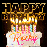A vibrant animated GIF featuring a delicious birthday cake topped with glowing candles and the name 'Rocky' in elegant script, and the words 'Happy Birthday' on the black background.