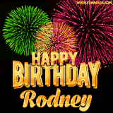 A captivating GIF with bursts of green, pink, and orange fireworks lighting up the night sky, accompanied by 'Happy Birthday Rodney' in glowing golden text.