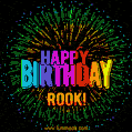 A colorful animated GIF featuring the text 'Happy Birthday Rook!' in rainbow colors with a dynamic iridescent firework display in the background.