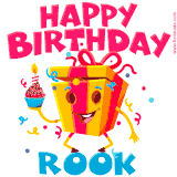 A funny animated birthday GIF with the words 'Happy Birthday Rooka', colorful gift box with arms and legs, holding a cupcake with a lit candle  with confetti everywhere.