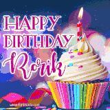 A festive animated GIF featuring a colorful cupcake with a single lit candle, sprinkles, and 'Happy Birthday Rorik' text against a sparkling, celebratory background.
