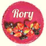 Beautifully decorated red velvet berry birthday cake with vibrant fruits and a glowing 'Rory' name, adding a touch of sweetness and sparkle.