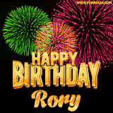 A captivating GIF with bursts of green, pink, and orange fireworks lighting up the night sky, accompanied by 'Happy Birthday Rory' in glowing golden text.