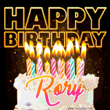 A vibrant animated GIF featuring a delicious birthday cake topped with glowing candles and the name 'Rory' in elegant script, and the words 'Happy Birthday' on the black background.