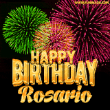 A captivating GIF with bursts of green, pink, and orange fireworks lighting up the night sky, accompanied by 'Happy Birthday Rosario' in glowing golden text.