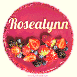 Beautifully decorated red velvet berry birthday cake with vibrant fruits and a glowing 'Rosealynn' name, adding a touch of sweetness and sparkle.